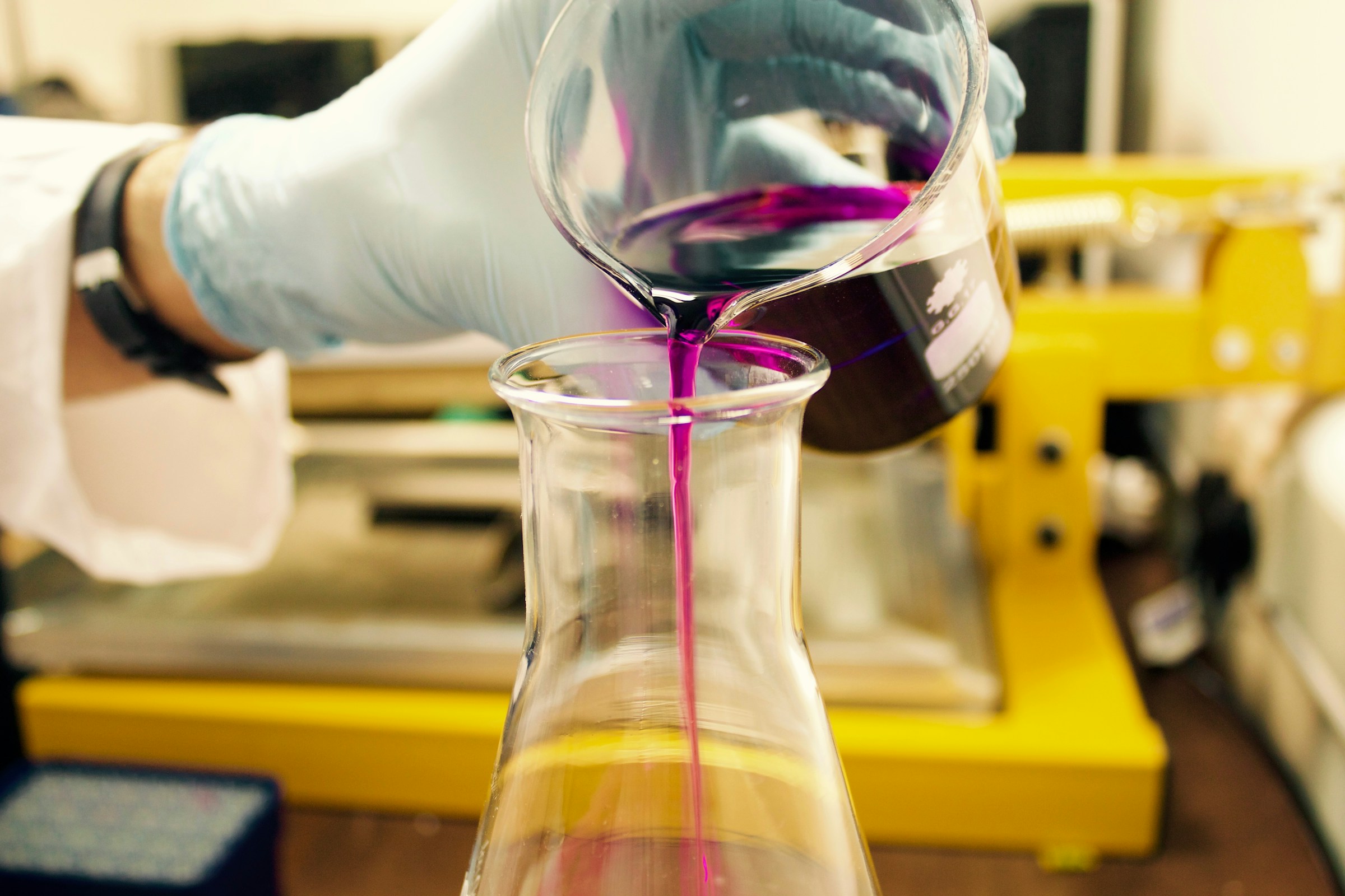 Laboratory glassware being used for controlled liquid testing